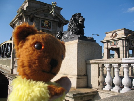 Yellow Teddy and a lion statue on Rochester Bridge