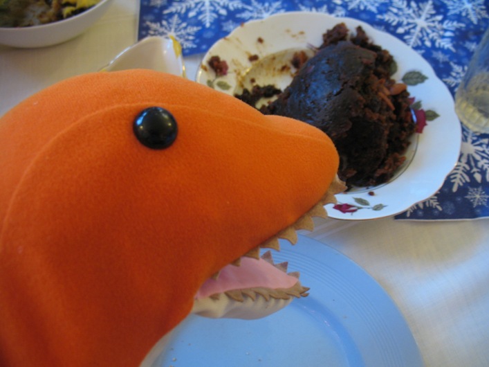 Dino with Christmas pudding