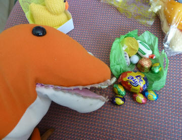 Dino checking on the little chocolate eggs and sweets