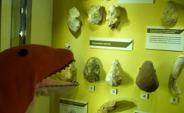 Dino with stone axes