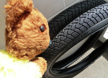Yellow Teddy with new bike tyres