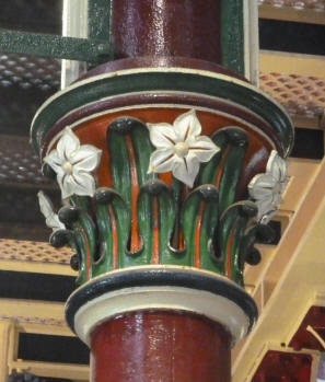 Top of pillar with flowers and leaves