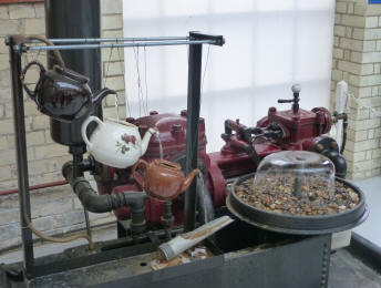 Pump with teapots and water fountain