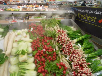 Vapour jets over vegetables in supermarket