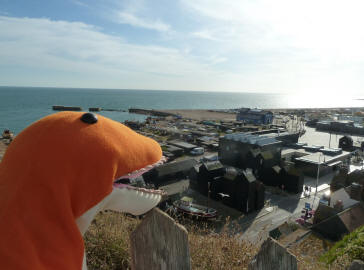 Dino looking over town from clifftop