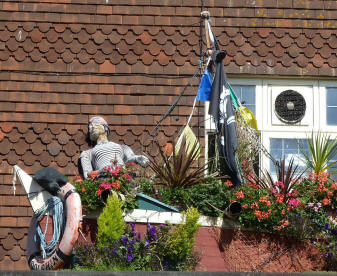 Boat display with flowers on roof