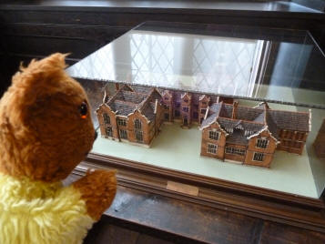 Yellow Teddy with model of Maidstone Museum