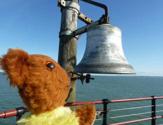 Yellow Teddy with pier bell