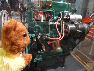 Yellow Teddy with car engine