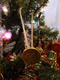 Chocolate coin hanging on tree