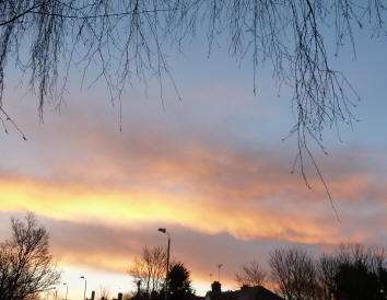 Rolls of orange dawn clouds