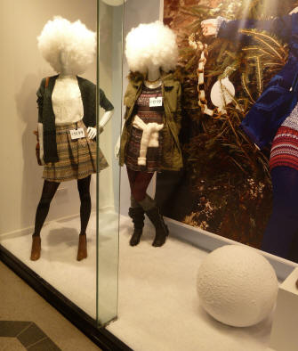 Shop window display with snowball, and fluffy snowball wigs
