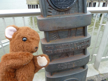 Brown Teddy with milepost