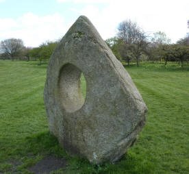 Stone sculpture with hole in middle