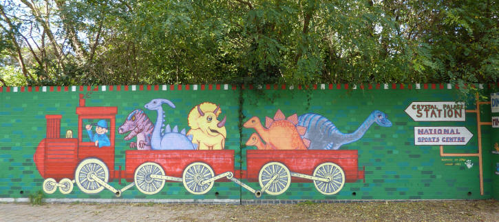 Dinosaur mural near railway station