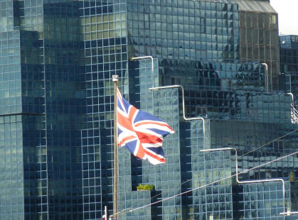Blue glass building and Union Jack flag